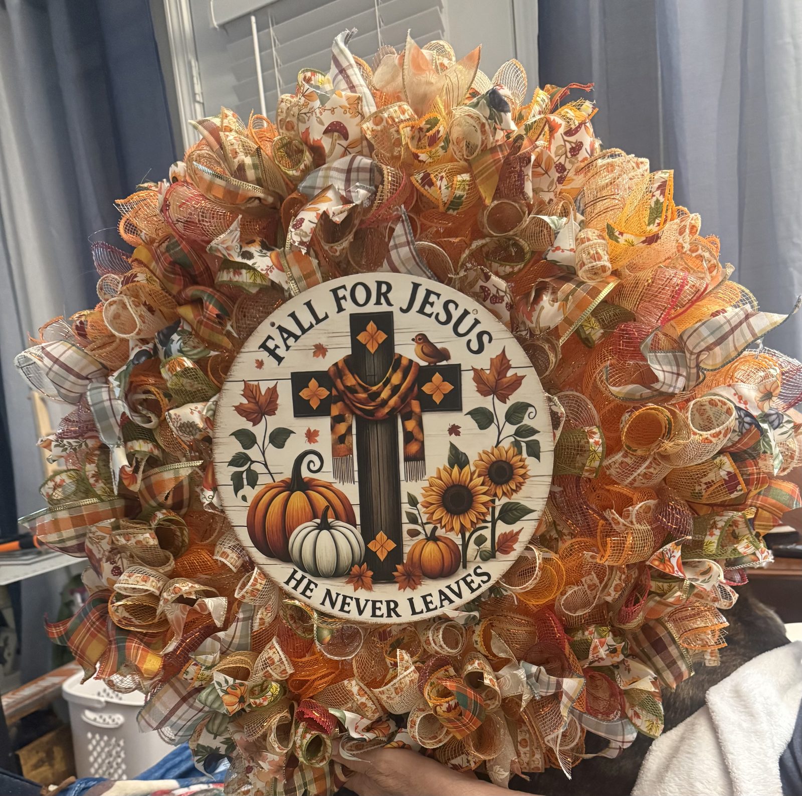Handmade fall wreath with a decorative sign
